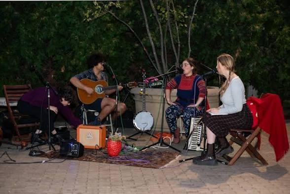 three band members performing